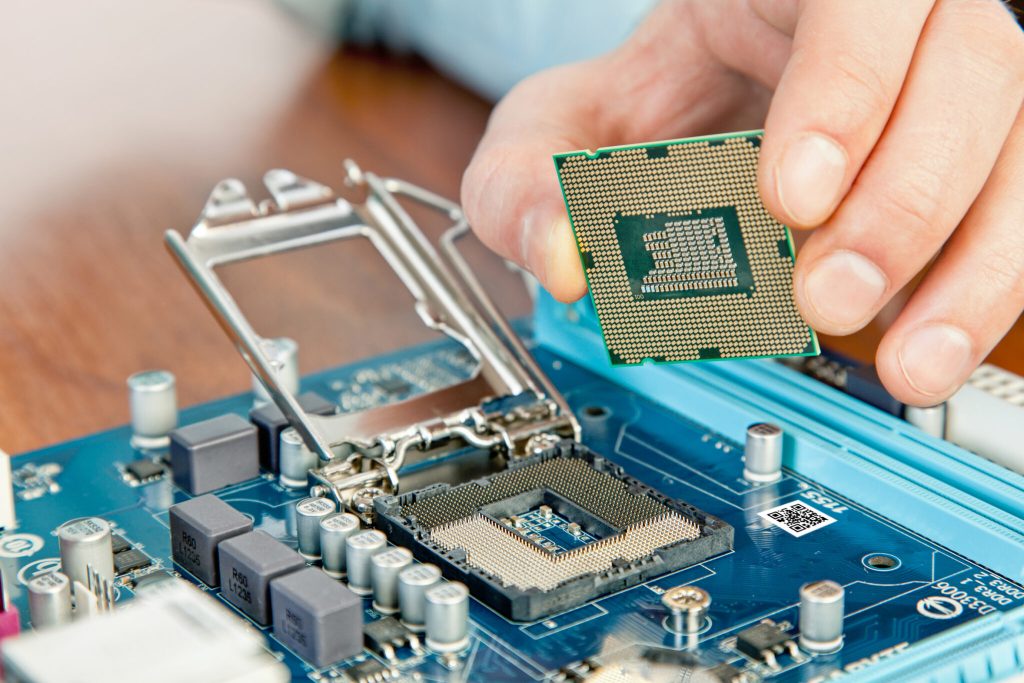 Technician repairing computer hardware in the lab